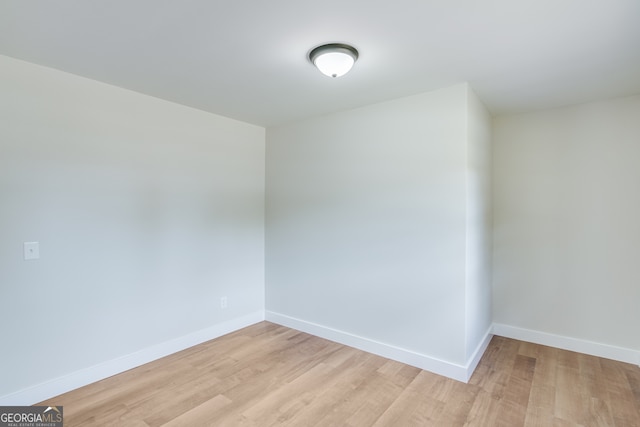 unfurnished room with light hardwood / wood-style flooring