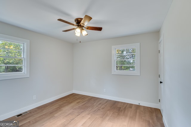 unfurnished room featuring light hardwood / wood-style flooring and ceiling fan