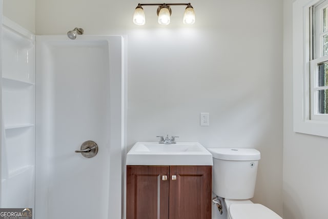 bathroom with vanity and toilet