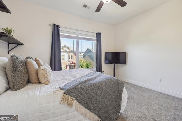 carpeted bedroom with ceiling fan