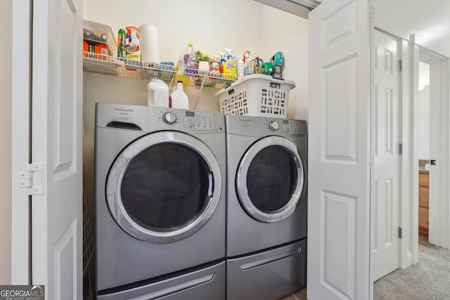 laundry area with independent washer and dryer