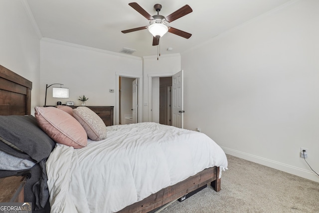 bedroom with carpet floors, ceiling fan, and crown molding