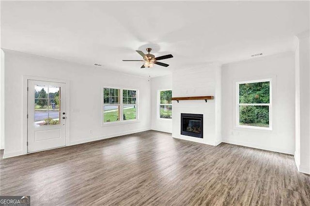 unfurnished living room with ceiling fan and dark hardwood / wood-style floors