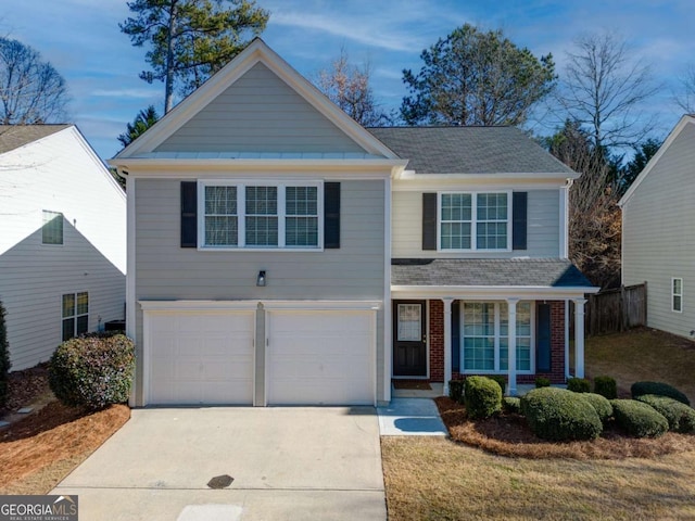 view of front facade featuring a front yard and a garage