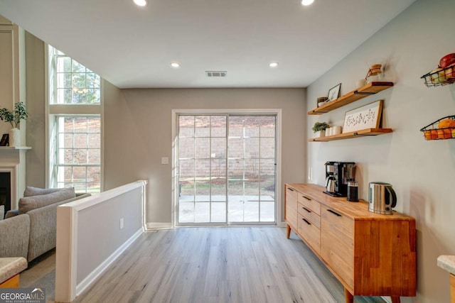 doorway with light hardwood / wood-style floors