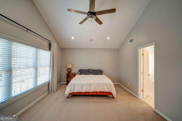 carpeted bedroom with ensuite bath, ceiling fan, and lofted ceiling