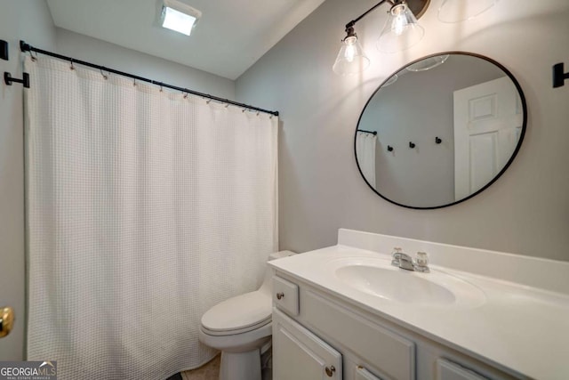 bathroom featuring vanity and toilet