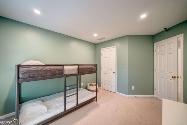 bedroom featuring light colored carpet