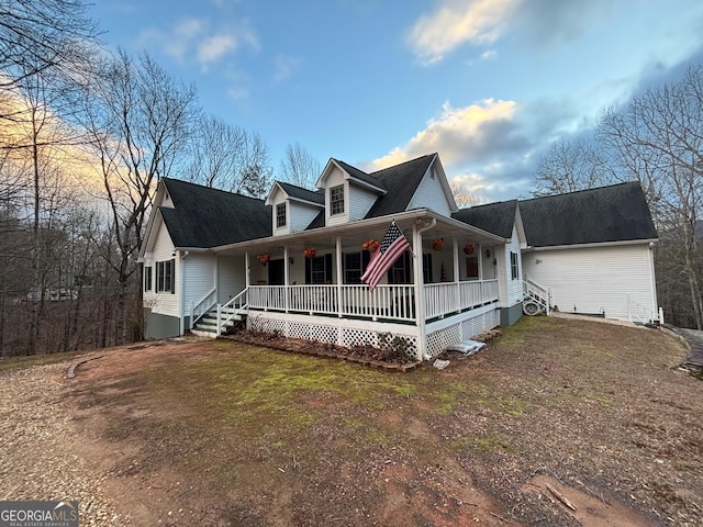 view of front of home with covered porch and a front yard