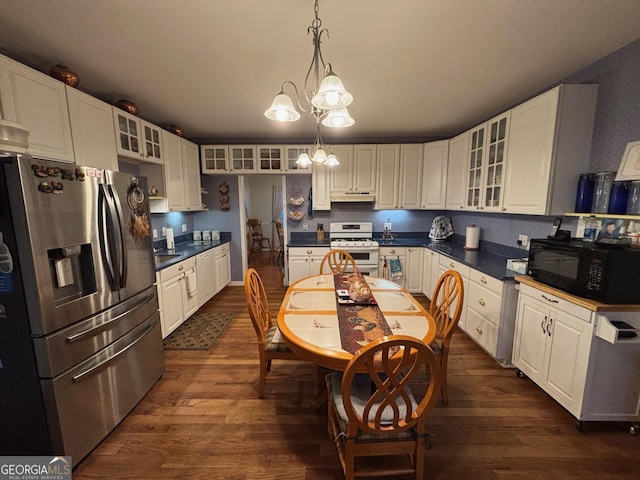 kitchen with gas range gas stove, stainless steel fridge with ice dispenser, a chandelier, decorative light fixtures, and white cabinets