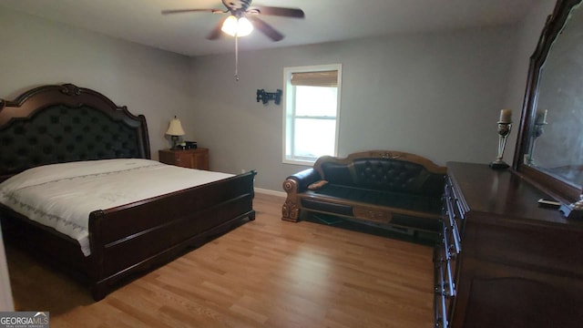 bedroom featuring ceiling fan and hardwood / wood-style flooring