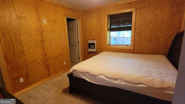 carpeted bedroom with wood walls and heating unit