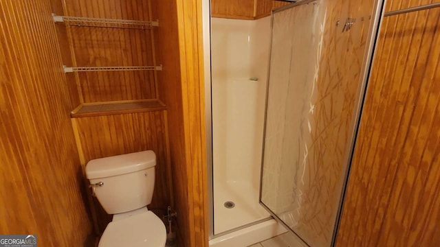 bathroom featuring toilet and walk in shower