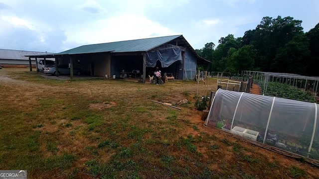 view of side of home with an outdoor structure