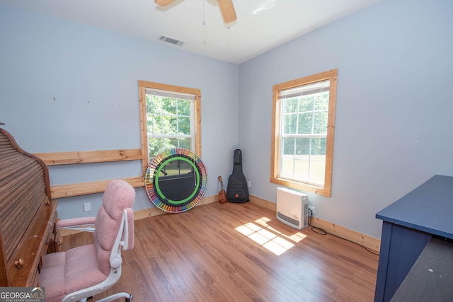 interior space featuring ceiling fan and wood-type flooring