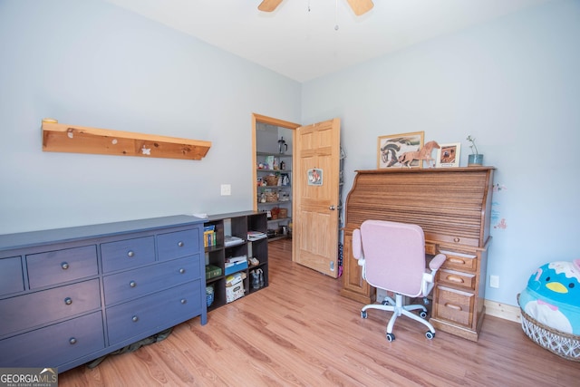 home office featuring ceiling fan and light hardwood / wood-style flooring