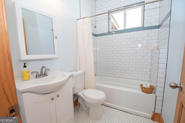 full bathroom with tile patterned floors, vanity, toilet, and shower / bathtub combination with curtain