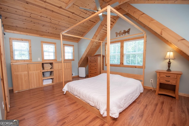 bedroom featuring wood-type flooring, vaulted ceiling with beams, ceiling fan, and wood ceiling