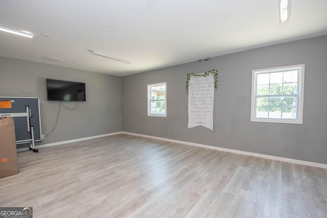 spare room with light wood-type flooring