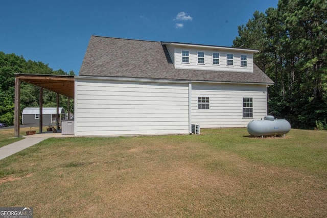 view of property exterior featuring a yard and a carport