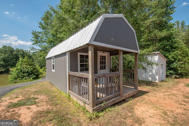 view of outbuilding featuring a lawn