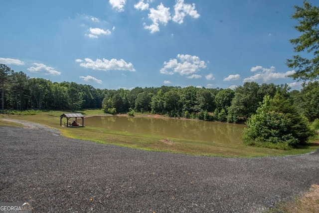 surrounding community featuring a water view