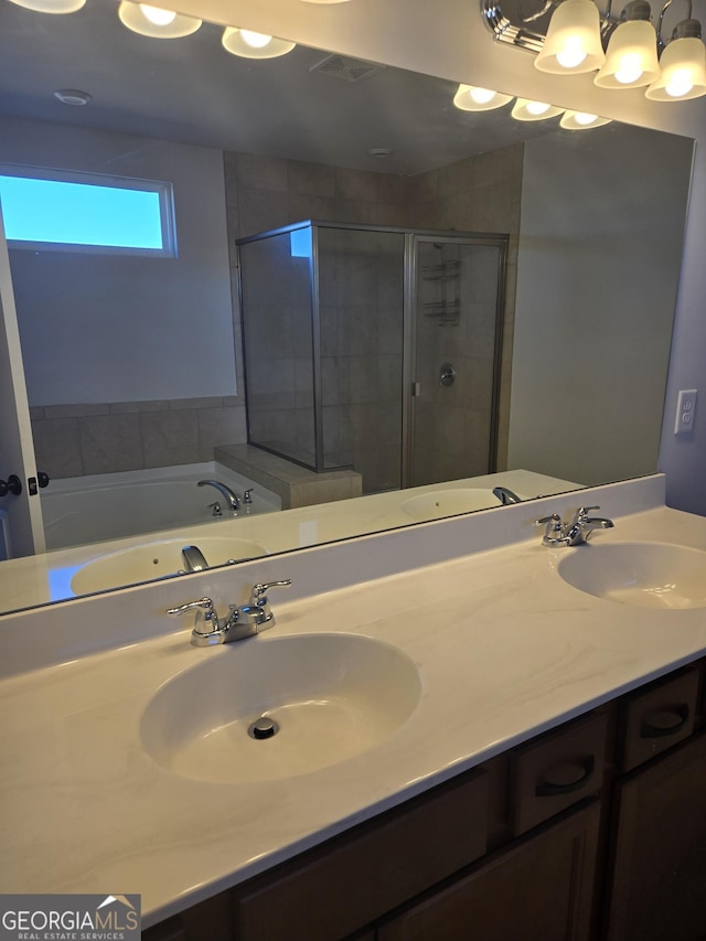 bathroom featuring vanity and separate shower and tub