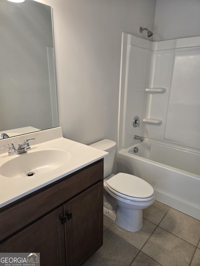 full bathroom featuring tile patterned floors, vanity, toilet, and bathing tub / shower combination