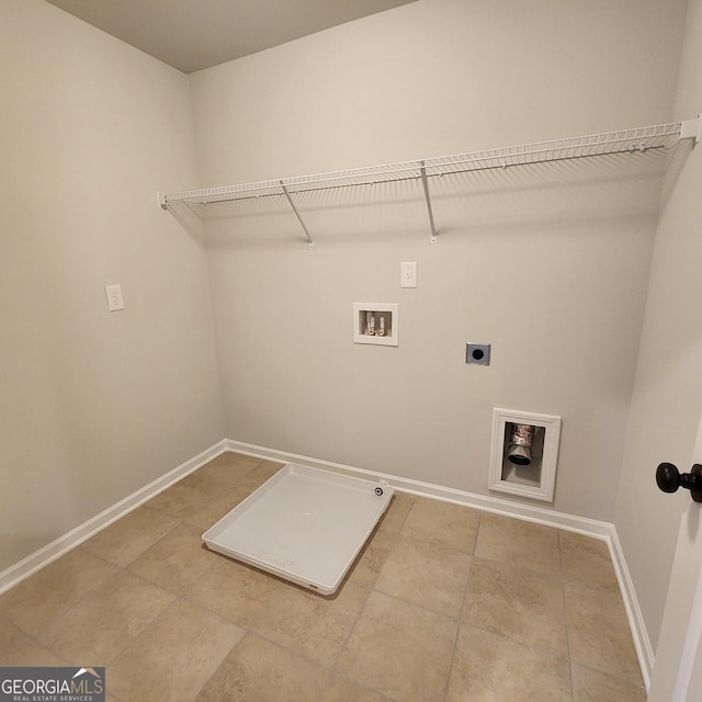 clothes washing area with tile patterned floors, electric dryer hookup, and hookup for a washing machine