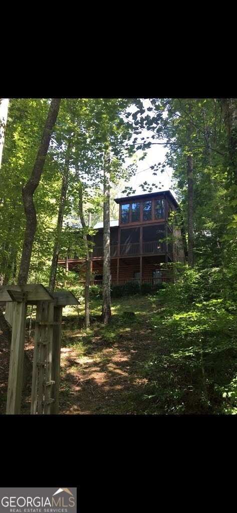 view of yard with a wooden deck