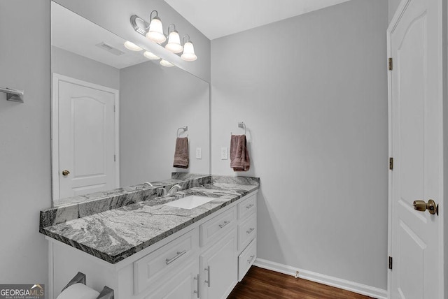 bathroom with vanity and wood-type flooring