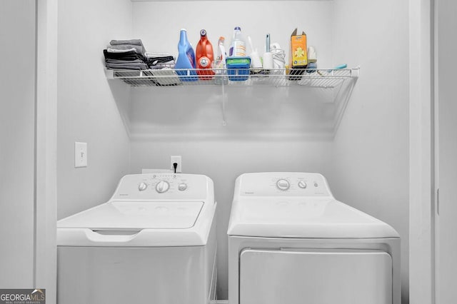 laundry room featuring washing machine and clothes dryer