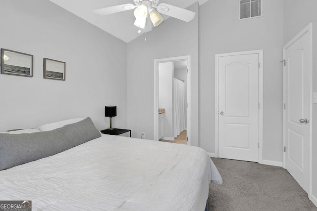 bedroom featuring ceiling fan, high vaulted ceiling, and light carpet