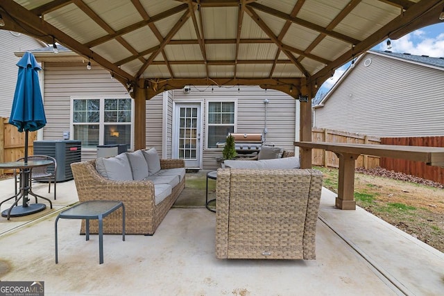 view of patio with a gazebo, an outdoor living space, area for grilling, and central air condition unit