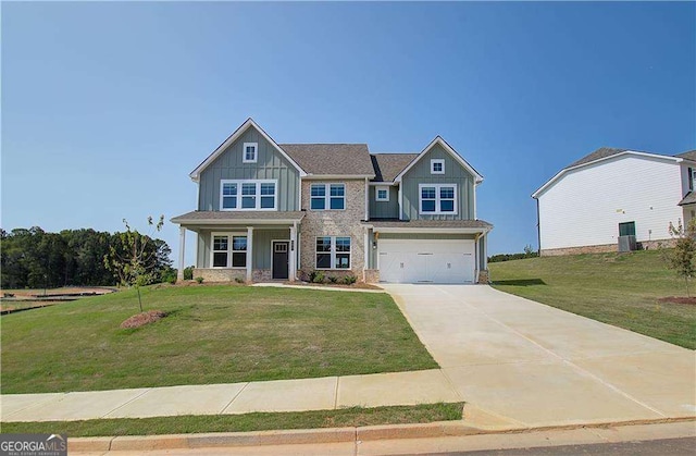 craftsman-style home featuring a front lawn and a garage