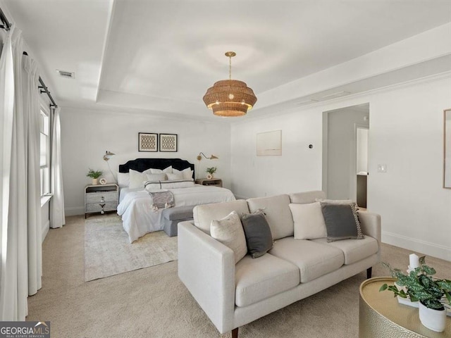 carpeted bedroom featuring a raised ceiling