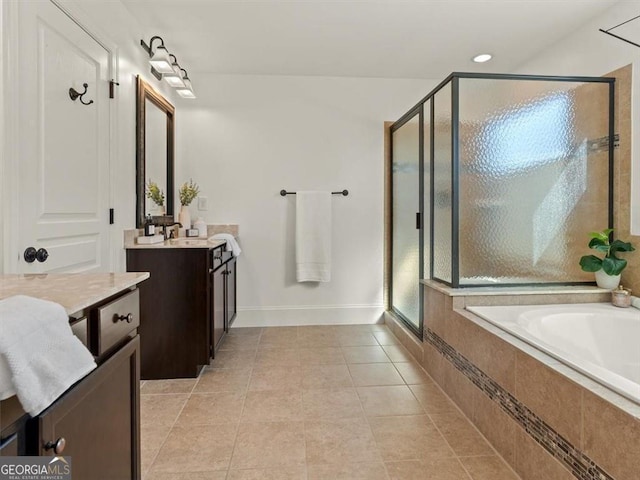 bathroom featuring vanity, plus walk in shower, and tile patterned flooring