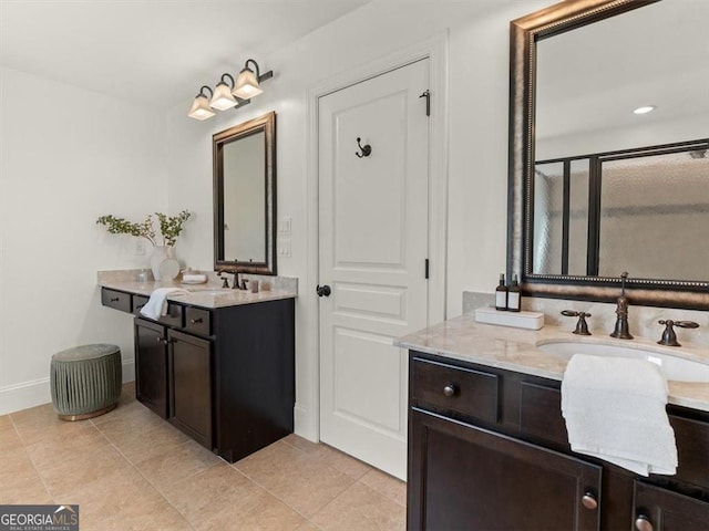 bathroom featuring tile patterned floors, vanity, and an enclosed shower