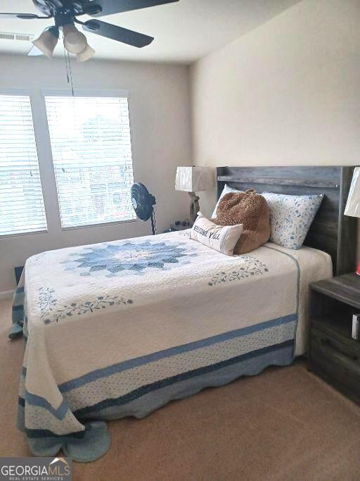 bedroom with carpet and ceiling fan