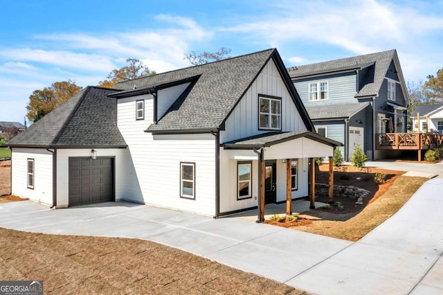 view of front of house featuring a porch and a garage