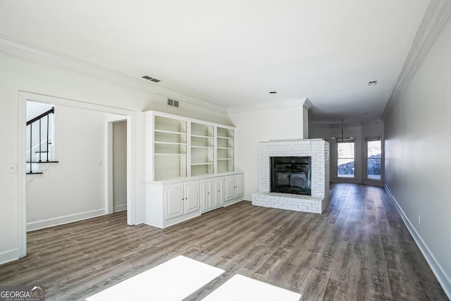 unfurnished living room featuring ornamental molding, a fireplace, and hardwood / wood-style flooring