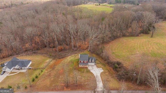 birds eye view of property with a rural view