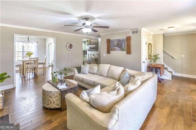 living room with ceiling fan, dark hardwood / wood-style floors, and ornamental molding