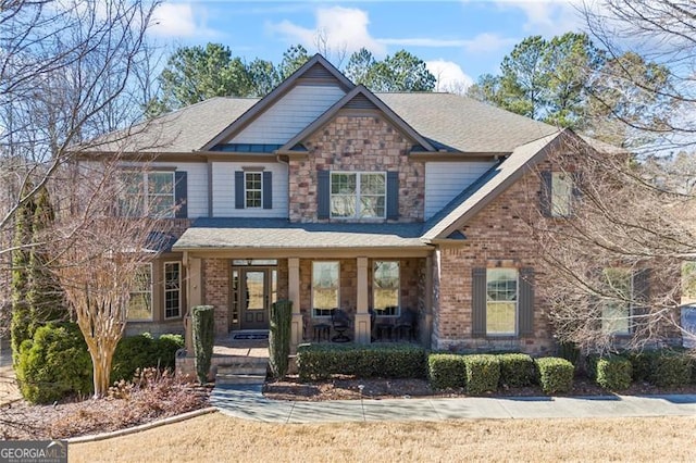 craftsman inspired home featuring covered porch