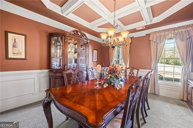 dining room with beamed ceiling, ornamental molding, light colored carpet, and coffered ceiling