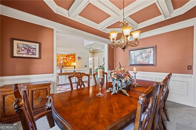 carpeted dining room with beam ceiling, an inviting chandelier, coffered ceiling, and crown molding