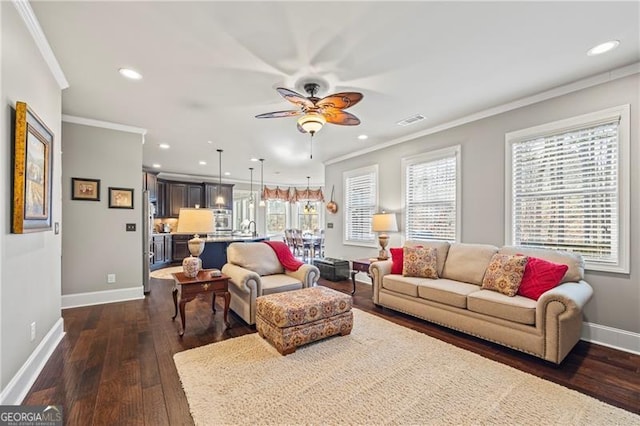 living room featuring crown molding, dark hardwood / wood-style flooring, and ceiling fan