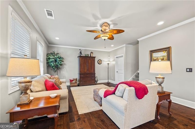 living room featuring ceiling fan, crown molding, and dark wood-type flooring