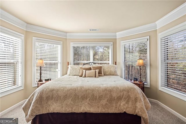 carpeted bedroom with crown molding