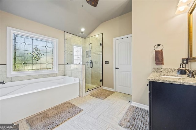 bathroom featuring tile patterned floors, vanity, ceiling fan, independent shower and bath, and lofted ceiling